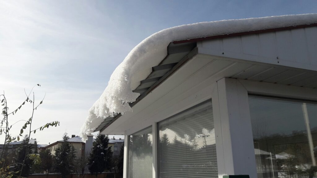 snow on metal roof